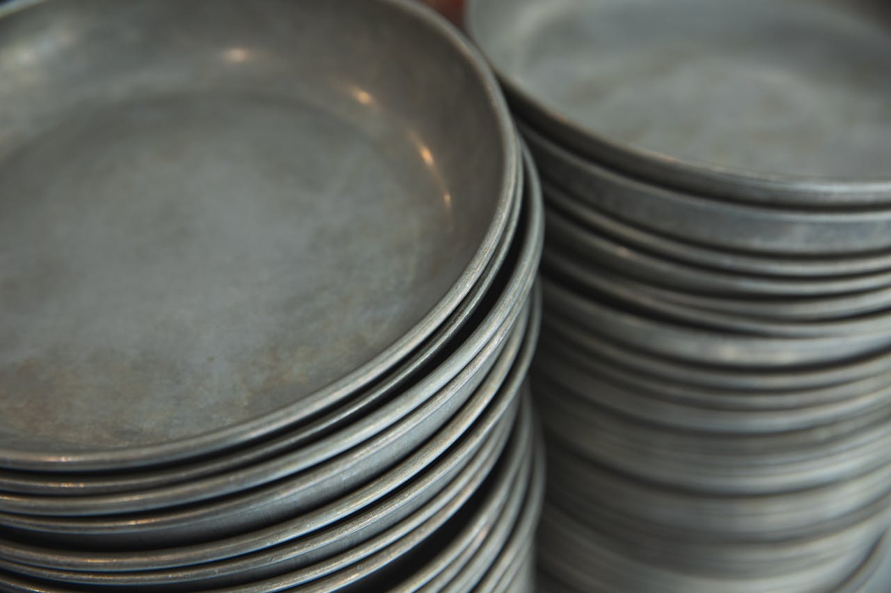 The Art of Drawing Readers In: Your attractive post title goes here From above of assorted round baking sheets placed on counter in shop in daytime